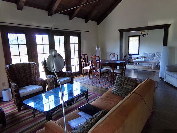 BACK PORTION OF LIVING ROOM AND DEN OR DINING ROOM