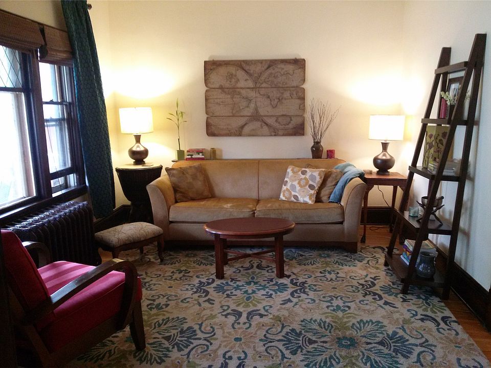 Large living room with huge South-facing windows.