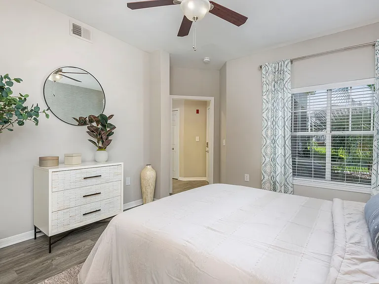 Step into the sun-kissed haven of our generously sized guest bedroom, featuring a magnificent double window that welcomes the radiant Florida sunshine. Bask in the pure pleasure of your daily retreat.