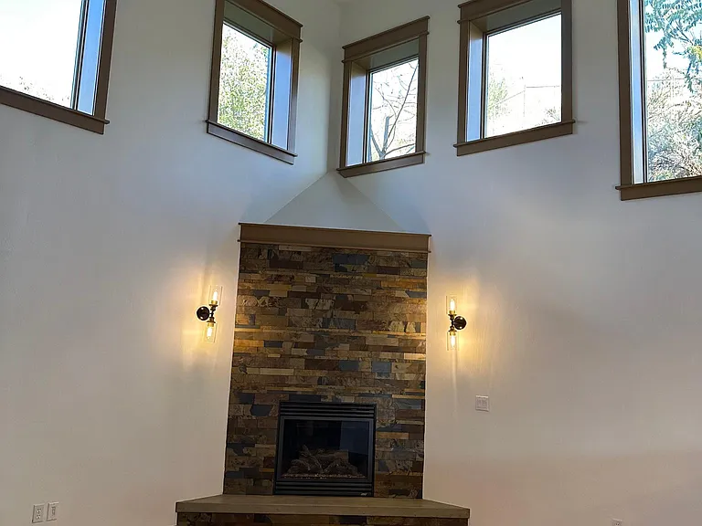 High ceilings, open floor plan, gas fireplace in living room