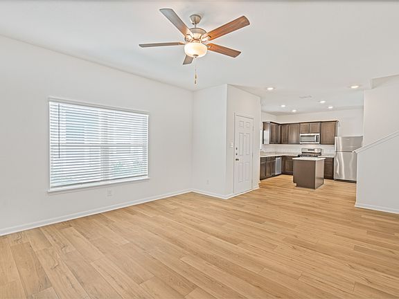 Open layout of the main floor with a large living room and chef-ready kitchen.