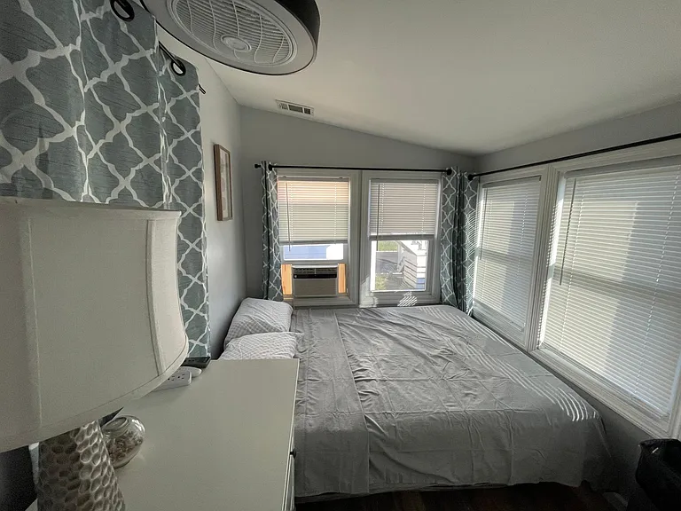 Flex room, with queen bed in place. For guests staying at least two weeks, a couch and coffee table can be put in its place for guests wishing for a second private living area.
