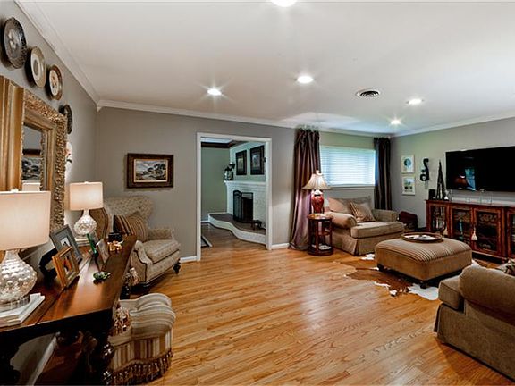 Another view of living room leading into dining room.
