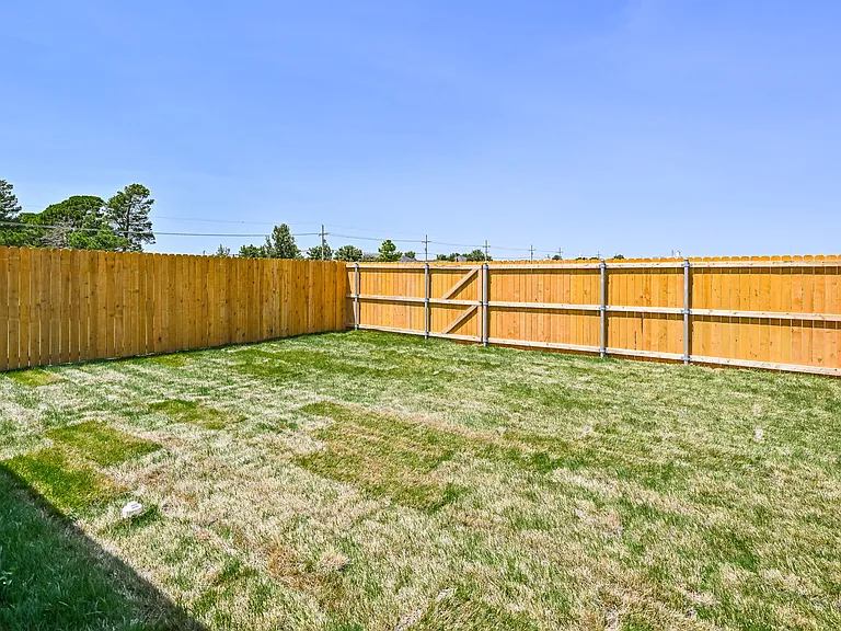 Fenced in backyard. Automatic sprinkler system. Landscaping included.