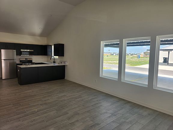 Kitchen and dining area space for barstools countertop.