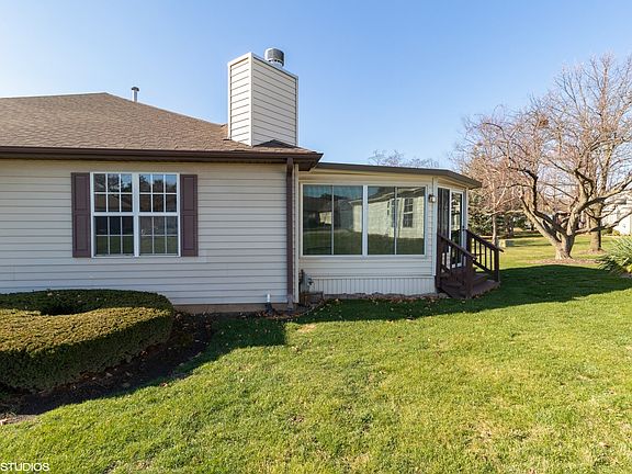 Rear view of home showing sunroom