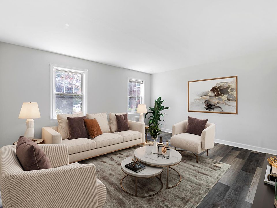 Living Room with new floors and freshly painted. Furniture is virtually staged.