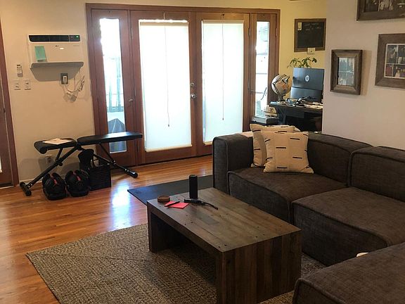 French doors with side lights leading to deck