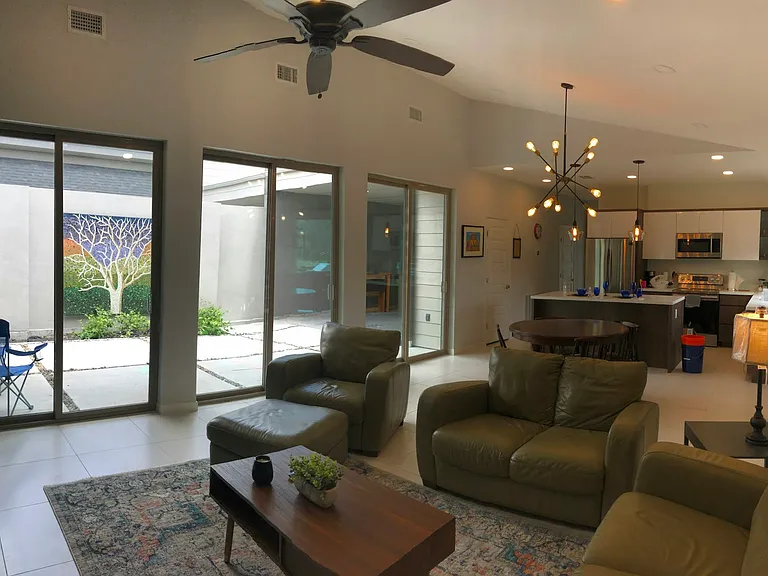Open Floor, 8' sliding doors allow for plenty of natural sunlight and 9-14' ceilings create an extraordinary space.