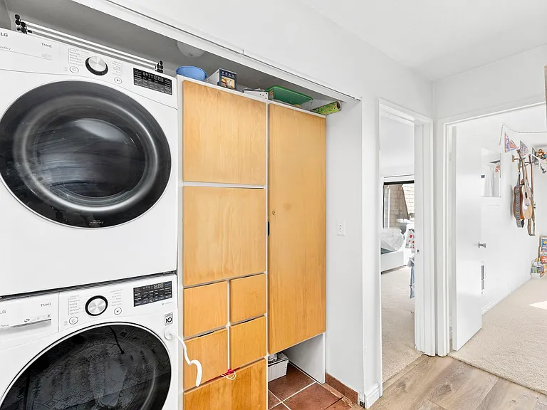 In-unit washer & dryer plus tons of storage in this first hallway closet