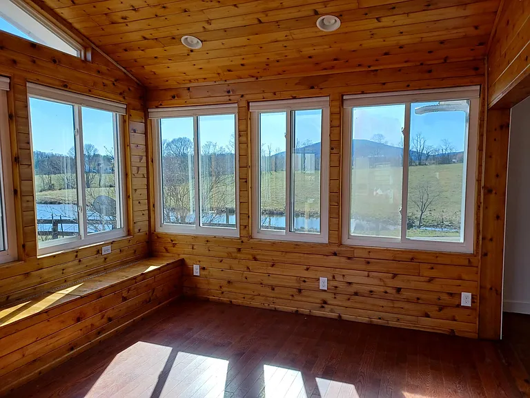 sunroom with built in bench that includes storage
