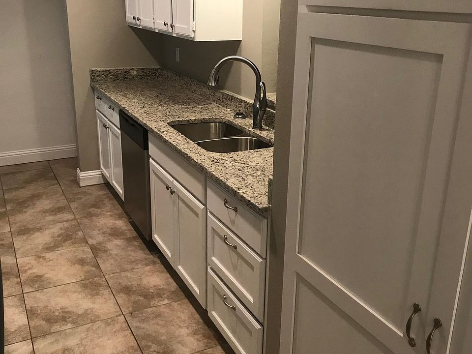 Kitchen with brand new flooring, cabinet, and granite counte