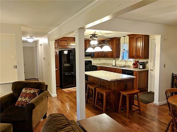 The center wall has been removed for an awesome open floor plan.