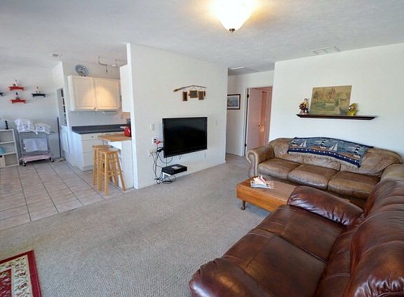 Living room complete with flatscreen TV.