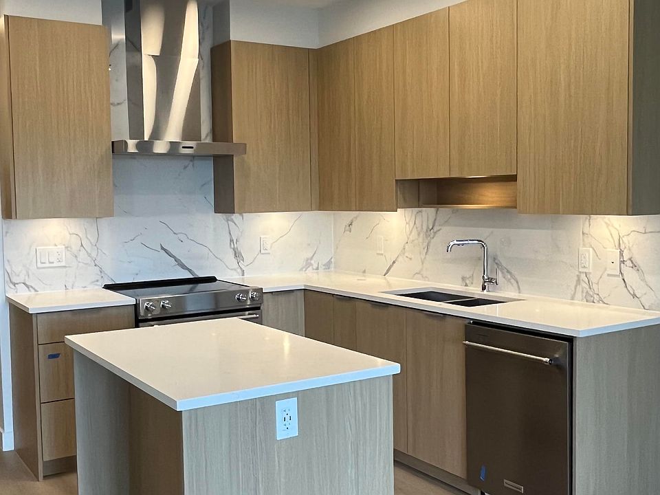 Kitchen with plenty of storage and a functional lay-out that includes an island for extra countertop space. Includes full-size stove/oven, fridge/freezer, dishwasher, microwave, exhaust fan