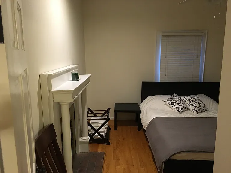 Second bedroom shown with a queen bed (house will be unfurnished).