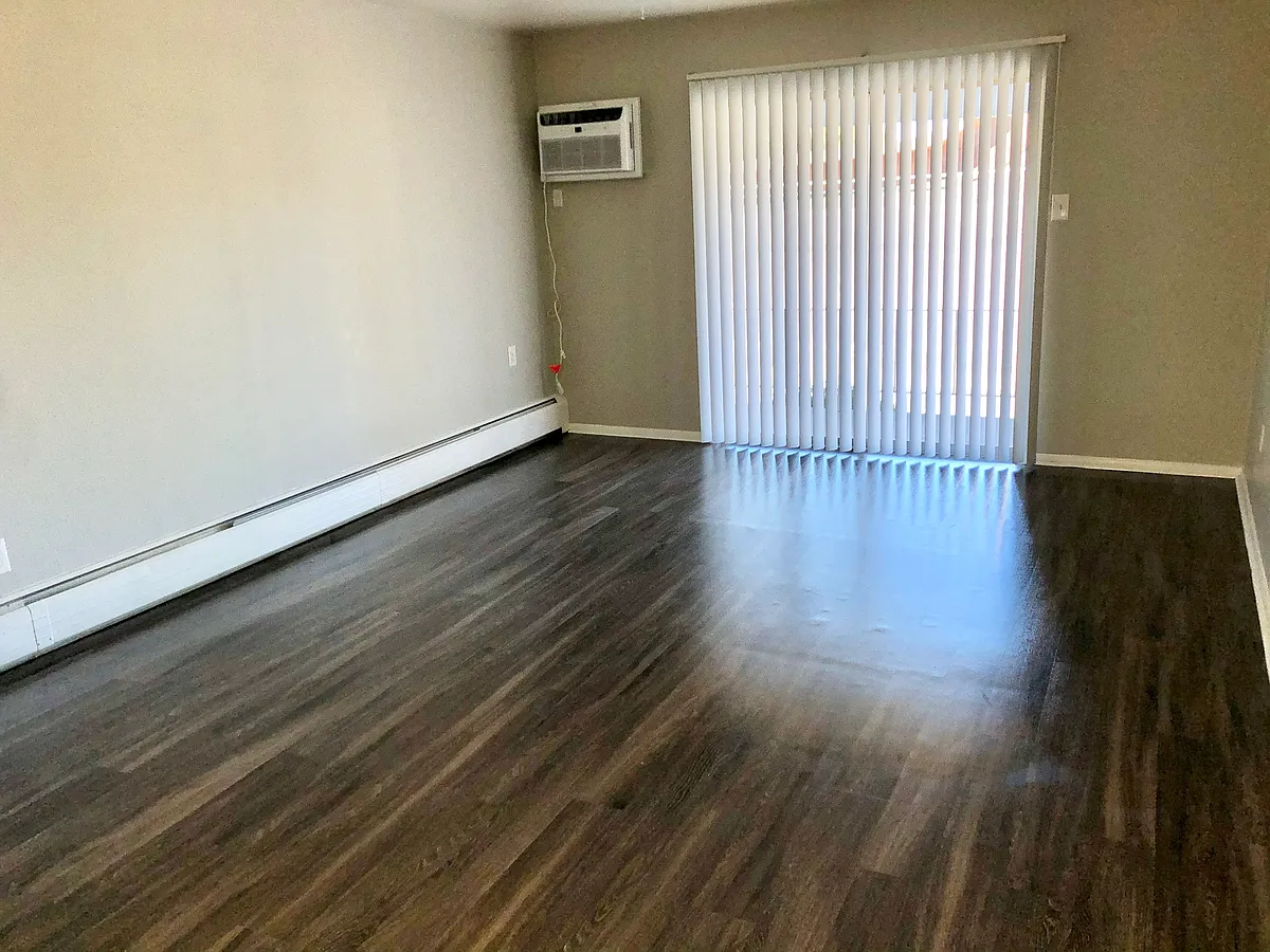 Experience the natural light and spacious design of this modern living room. Experience the natural light and spacious design of this modern living room. - Grace Landings Apartments