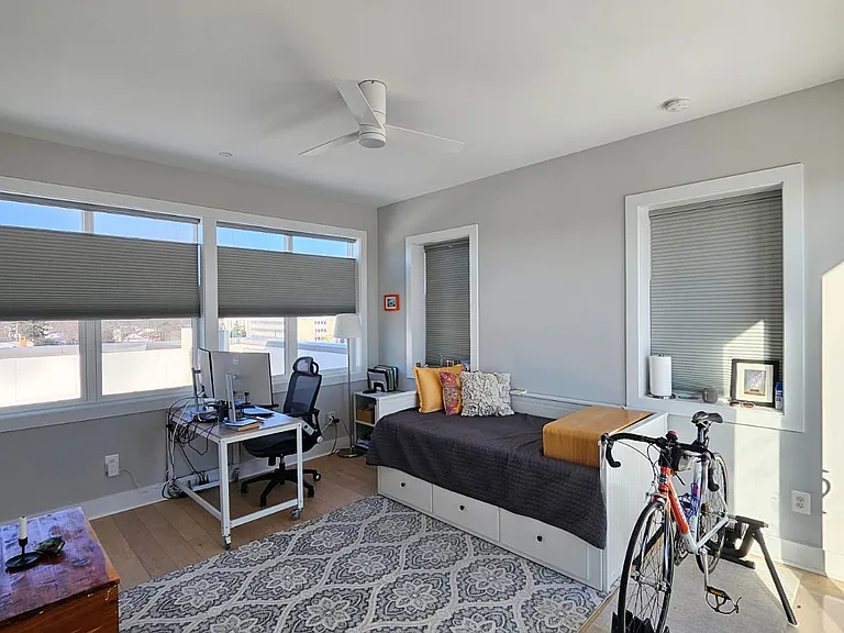 3rd floor office with a small full bath and closet.