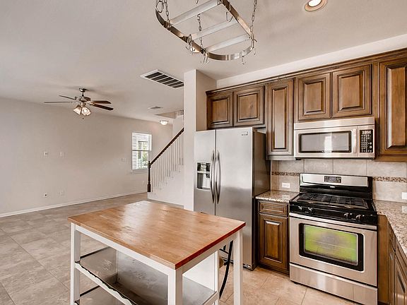 Kitchen opens up to the living room. Great for hosting!