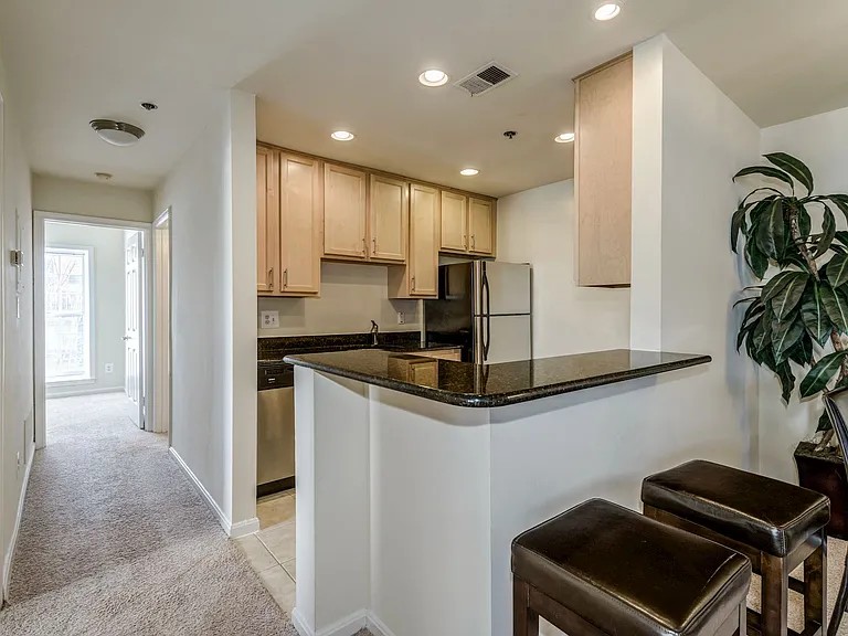 Gourmet Kitchen with Dishwasher, Garbage Disposal, Microwave, Granite Countertops, and Modern Appliances
