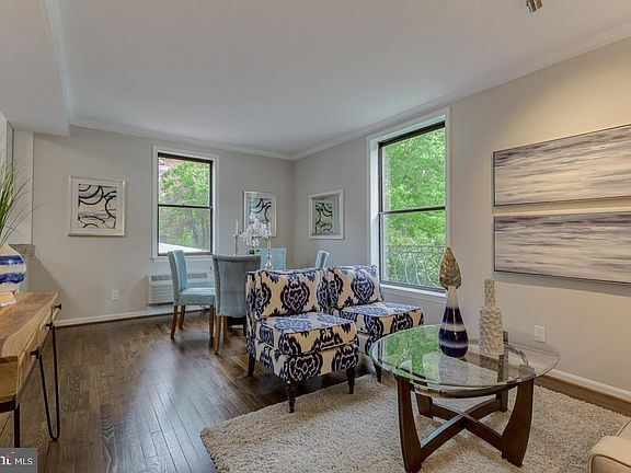 Living/dining space with large windows