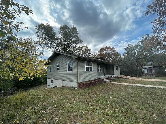 Left side of the house.