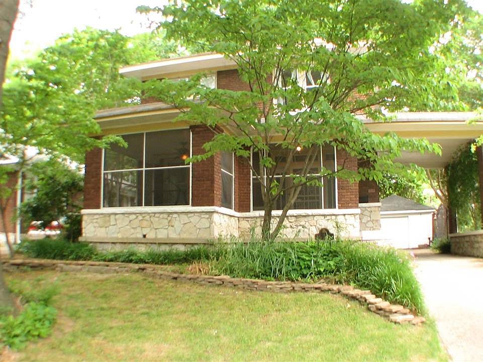 Large Screened front porch & covered parking on a shaded homesite