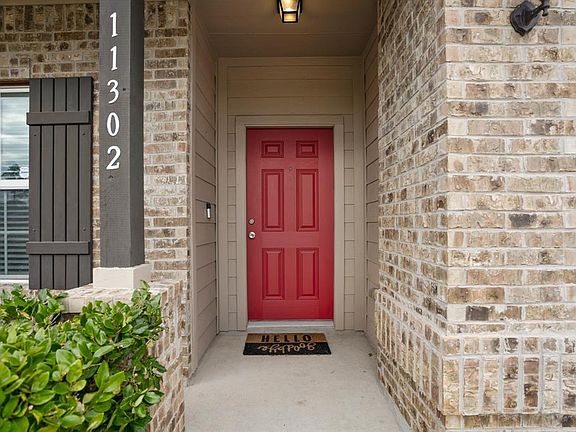 But first, let's appreciate this beautiful front porch! The dark trim & light house number make your address easy to spot from the street. With a large covered porch like this, you'll never leave anyone or even packages sitting out in the rain!