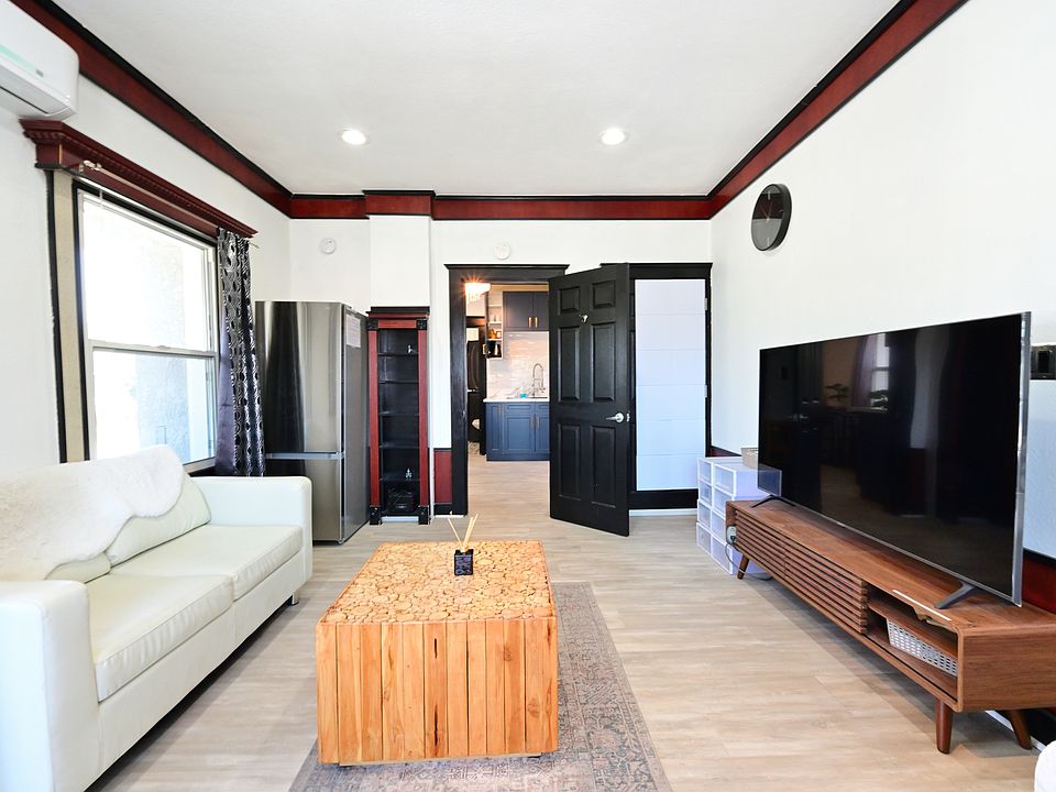 Fully Furnished & Updated LARGE and BRIGHT Studio w/ in-unit laundry + private balcony + parking
