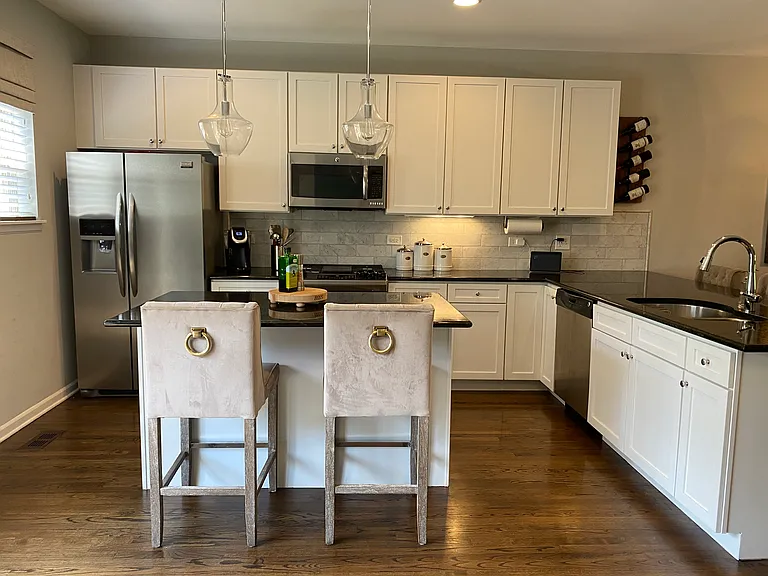 Massive kitchen with island and large peninsula with seating