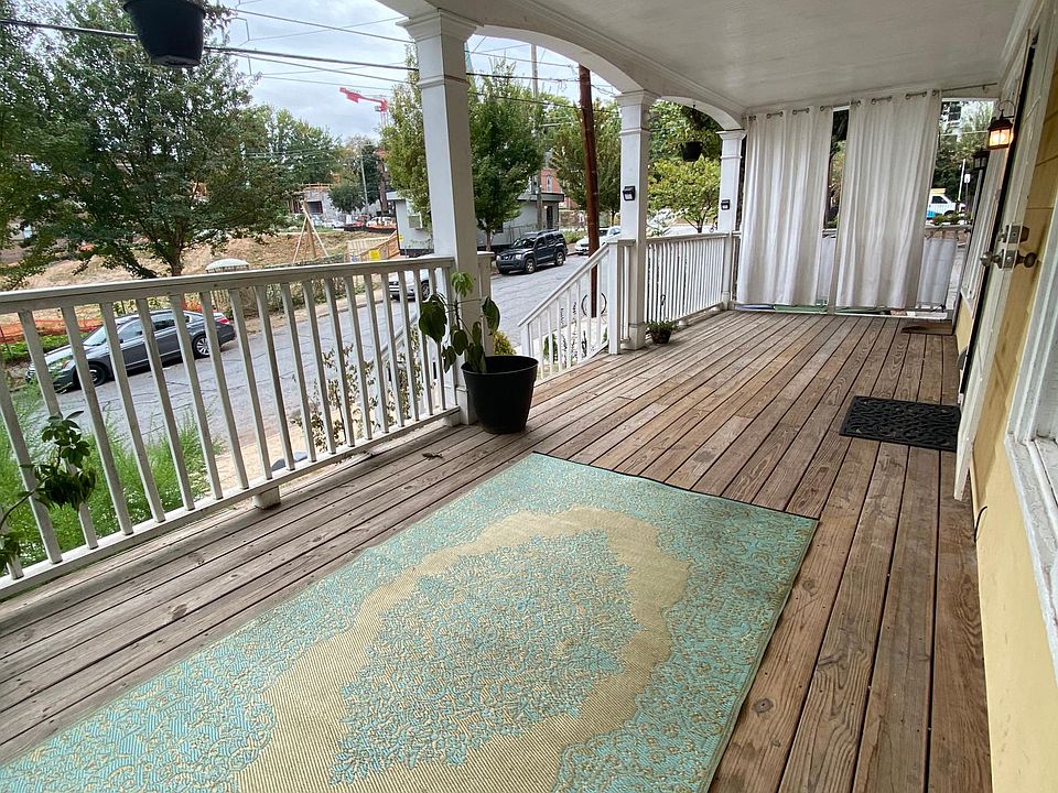 Spacious front porch 10ftx30ft that gets great natural light for all the plant lovers.