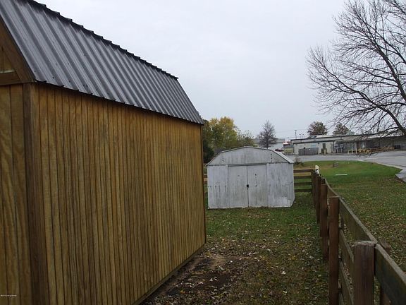 Sheds are close to rail fence