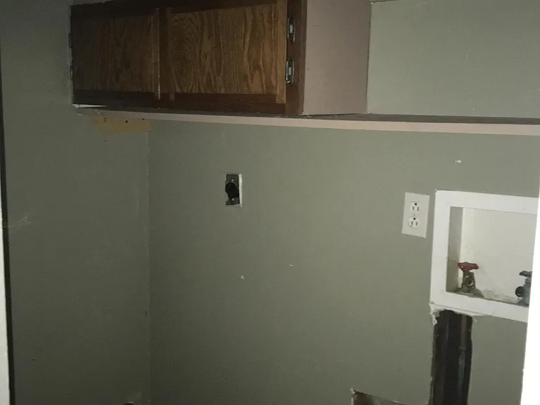 Laundry room between garage and kitchen breakfast nook