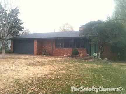 Front of House : Large front yard with mature trees.