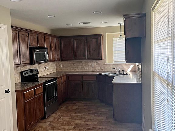 Kitchen includes stove, Microwave, Dishwasher