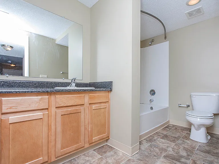 Full Bathroom with Vanity and Storage Space