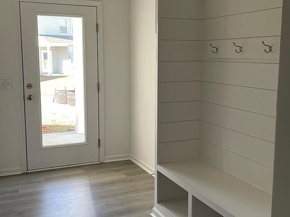 Mud room for coats and shoes and easy access to garage and outdoor patio.