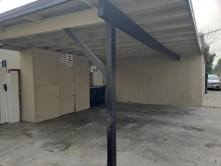 This is a view of the two car, car port. One space is included in the rent with this unit. Notice the large size storage area with can be locked with your lock