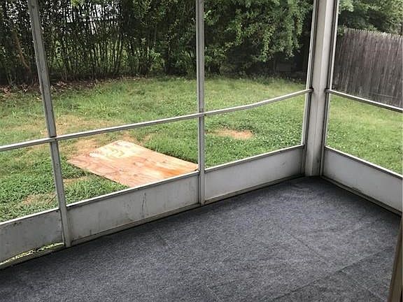 Enjoy your private, fenced back yard from the screened porch.