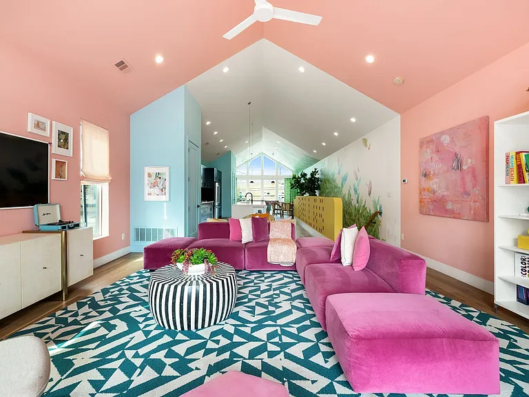 Vaulted ceiling with a ceiling fan and recessed lighting