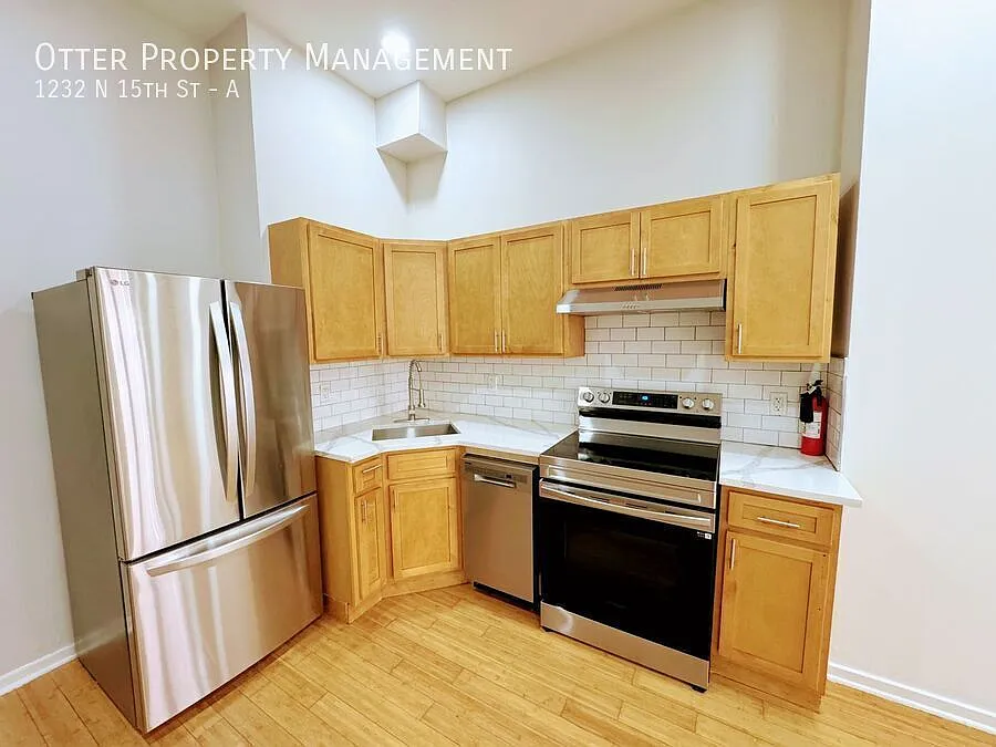 Spacious 2BR/1BA with Finished Basement, Private Backyard & In-Unit Laundry — Photo 4