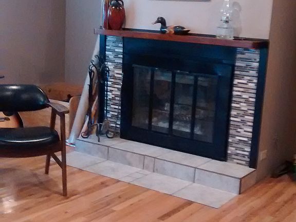 Den, fireplace new tile surround