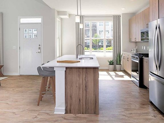 Upgrade Scheme townhome kitchen and dining areas with hard surface flooring