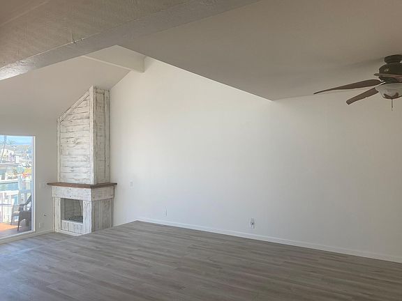 Living room on first floor- leads to two large decks for entertaining- overlooking waterway.