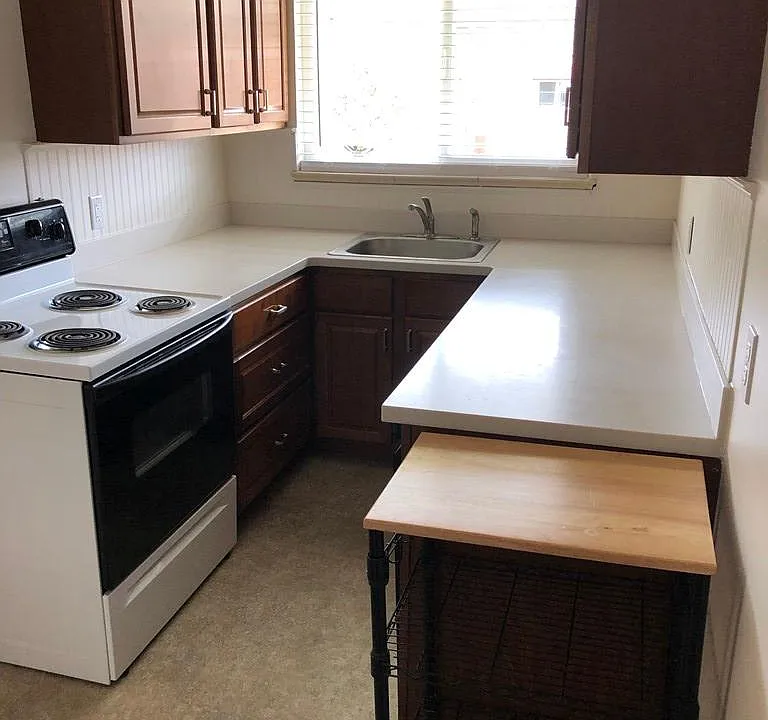 Ample cabinet space, bright kitchen.