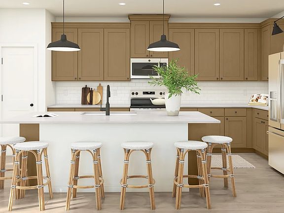 Kitchen with pendant lights over island