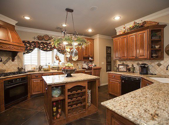 Gourmet kitchen with recessed lighting