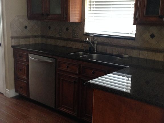Kitchen-granite & travertine