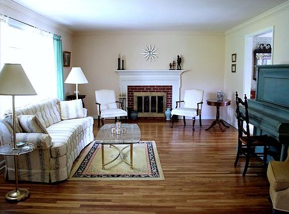 Bright and large living room with first fireplace