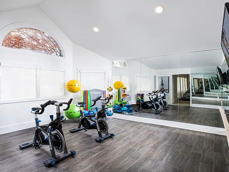 Fitness studio with bikes and free weights